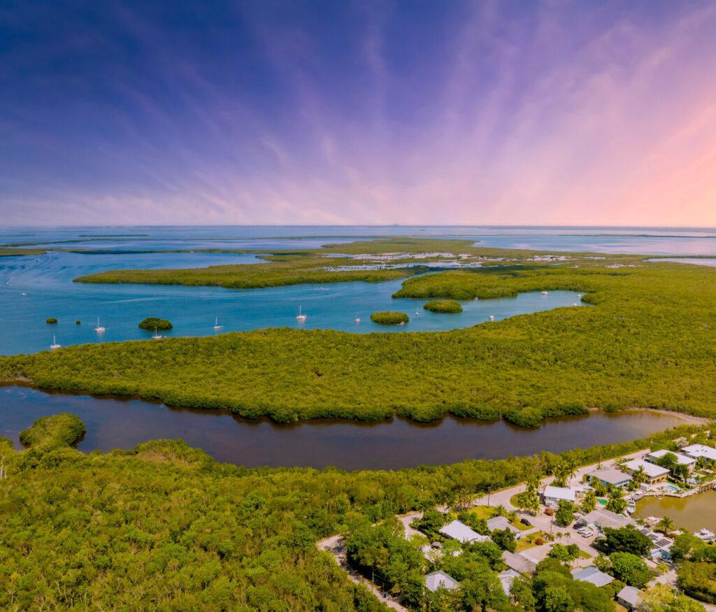 An aerial view of the beautiful sky and water at a beach in Key Largo.